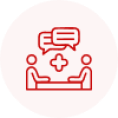 Red icon featuring two abstract figures sitting across a table, with speech bubbles above, indicating communication or discussion.